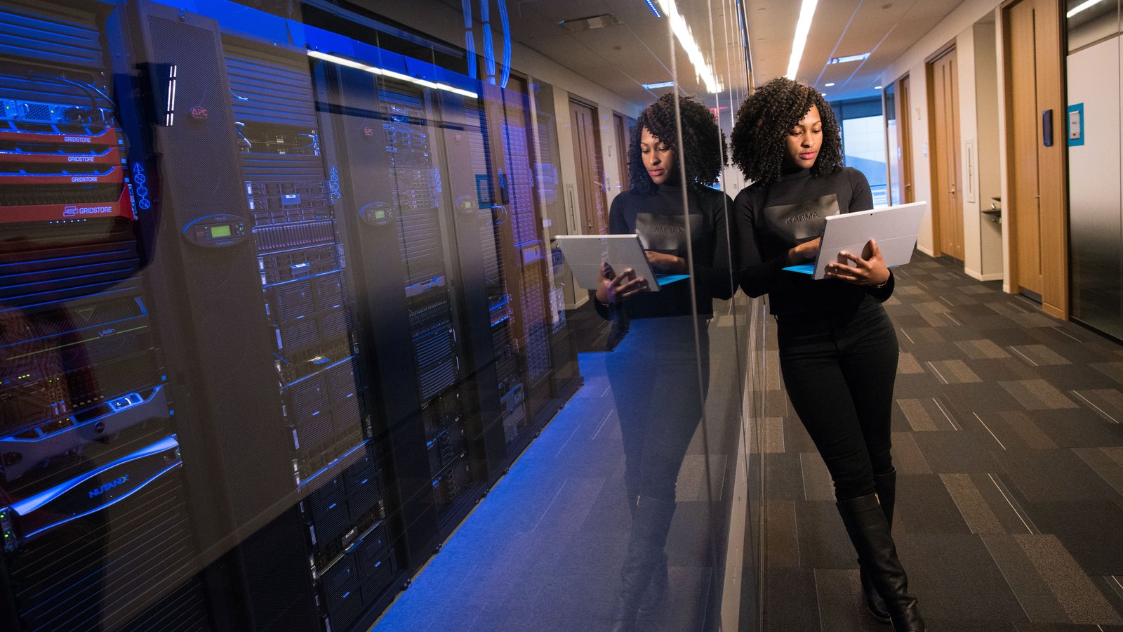 Technology professional working with data dashboards on office screens — Enterprise AI Integration for Financial Services & Banking
