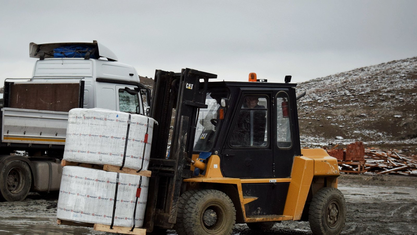 Shipping containers stacked at a port customs terminal — Customs & Freight Advisory for Cross-Border Trade